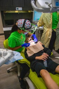 Dr. Chong a female dentist in Leduc Alberta helping patients at Oasis Family Dental keep healthy smiles
